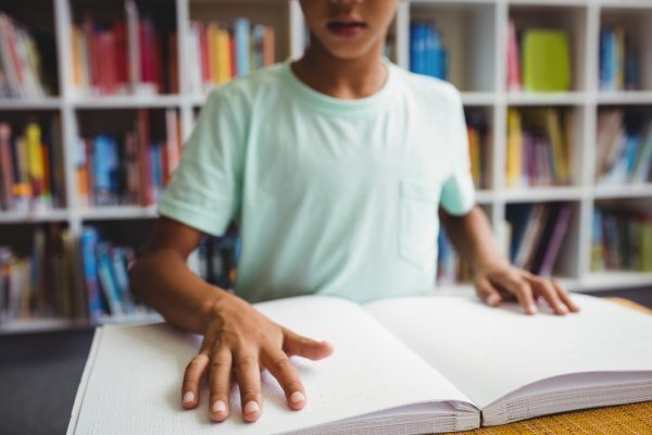 <p> depositphotos_108981176-stock-photo-boy-using-braille-to-read </p>