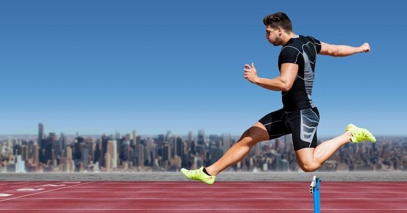 <p> Digital composition of athlete jumping over a hurdle on race track against cityscape in background </p>