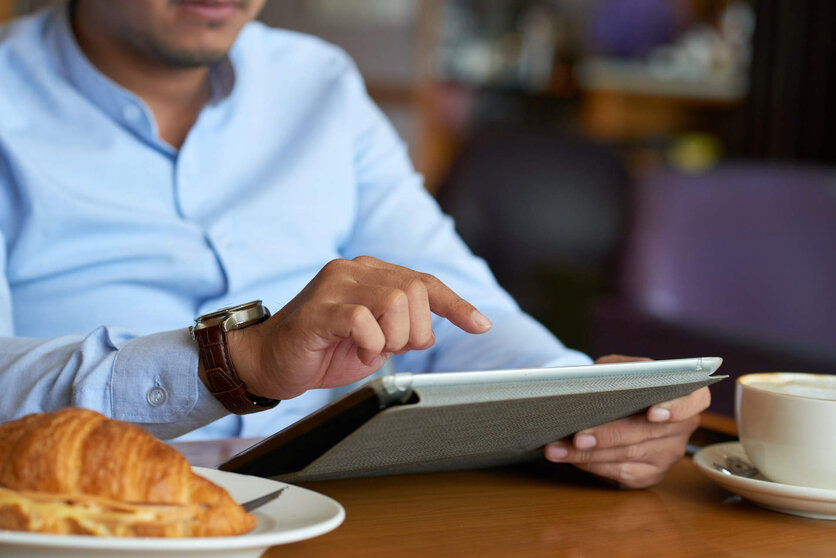  Close-up image of businessman using application on digital tablet 